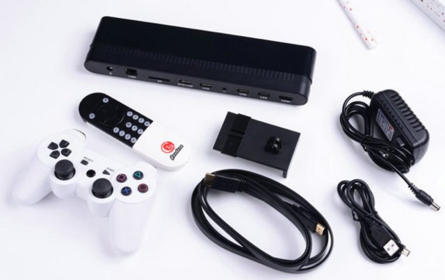 Pandora TV Box with its remote, game controller, power supply, and cables.